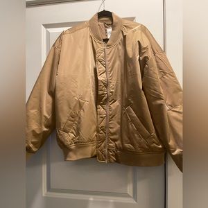 Gold Bomber jacket brand new with tags from Abercrombie and Fitch. Never worn